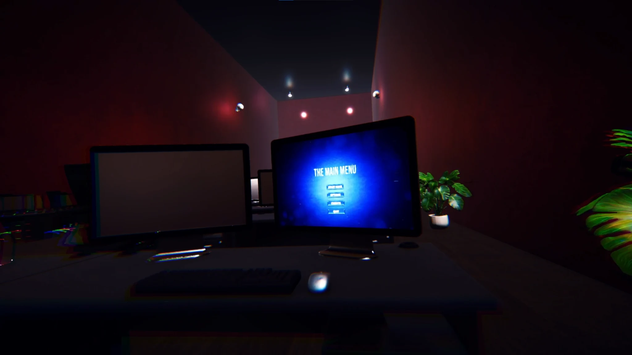 Two monitors in the dark room, one displaying The Main Menu